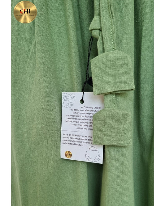 Green garment with a tag on a white background