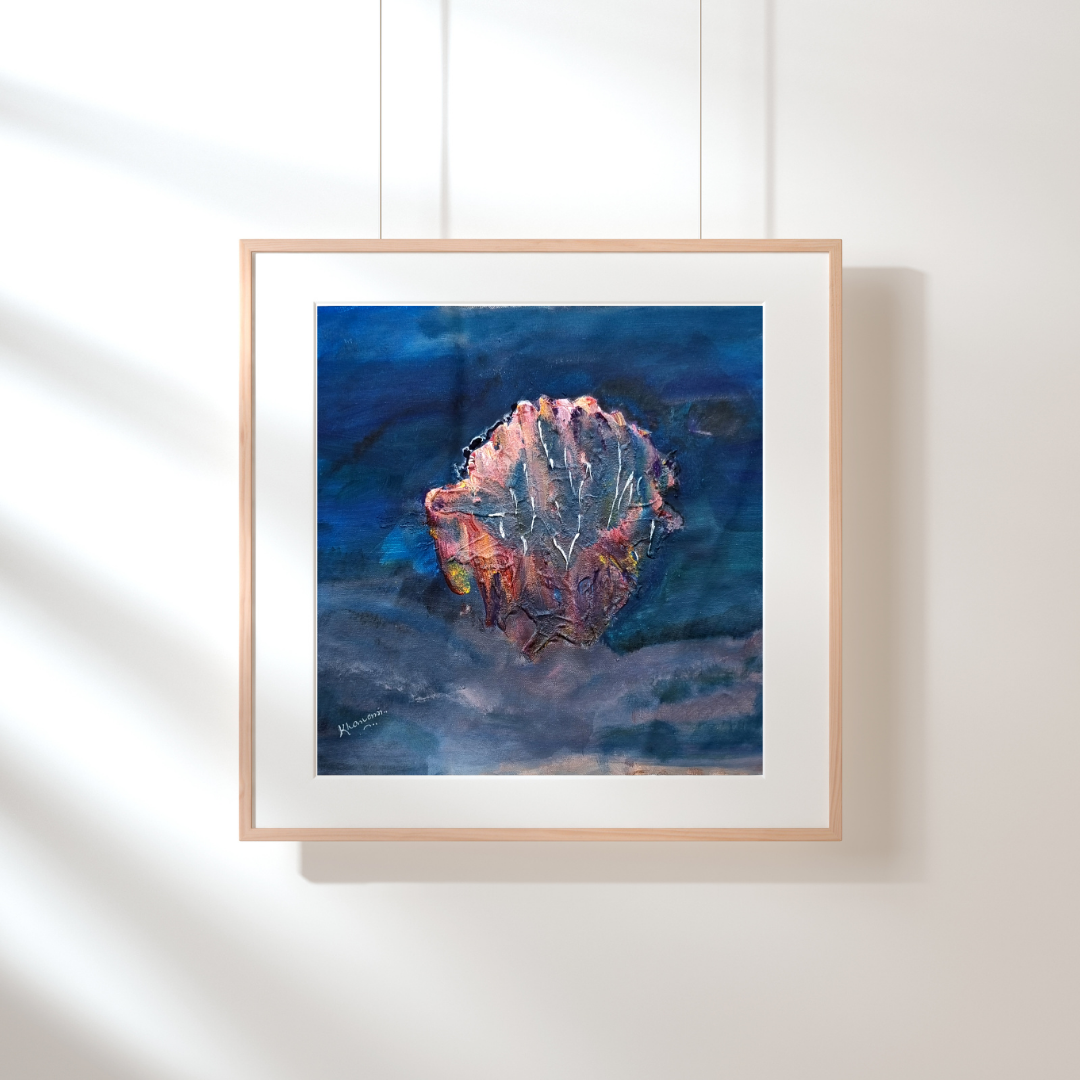 Framed abstract art piece with a blue and orange color scheme on a white wall.