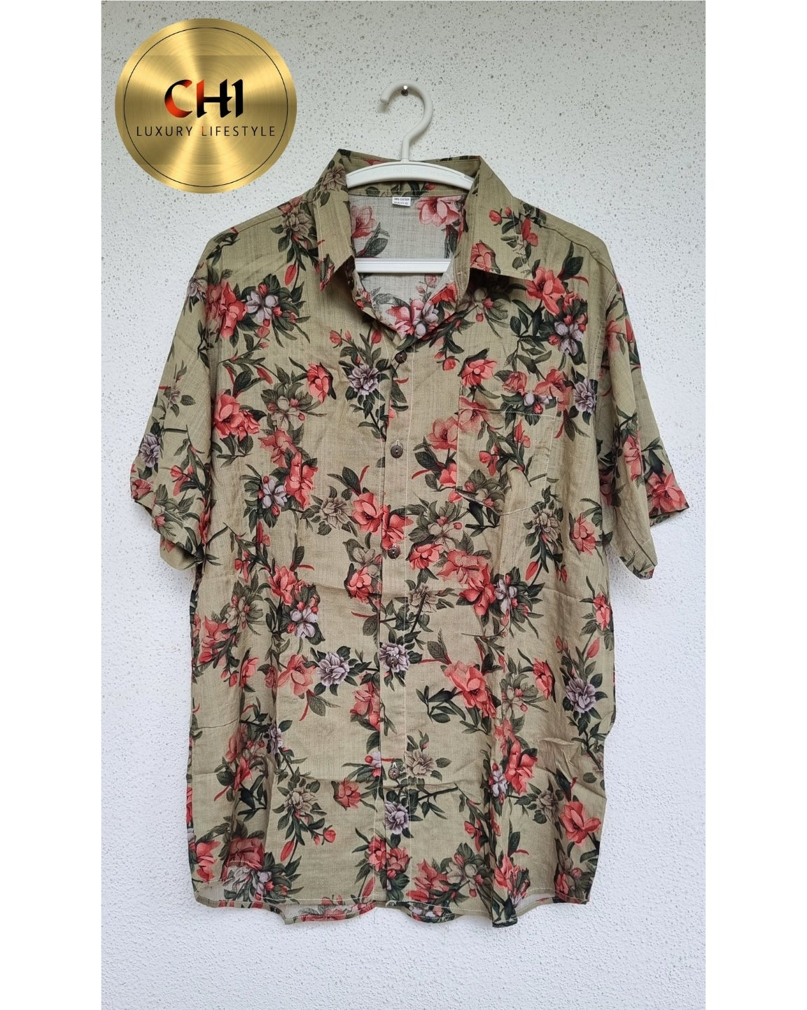 Floral patterned shirt on a hanger with CHI logo in the corner.