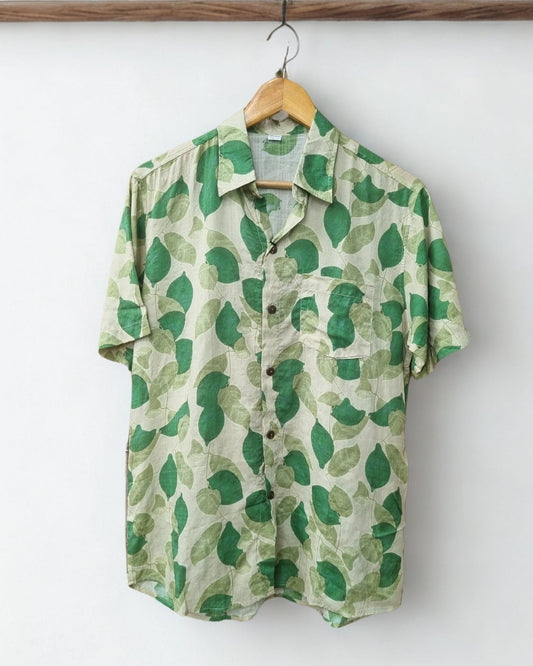 Green patterned shirt on a hanger against a white background with a visible brand logo.