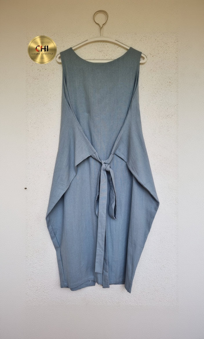 Blue sleeveless top with a tie detail on a white background