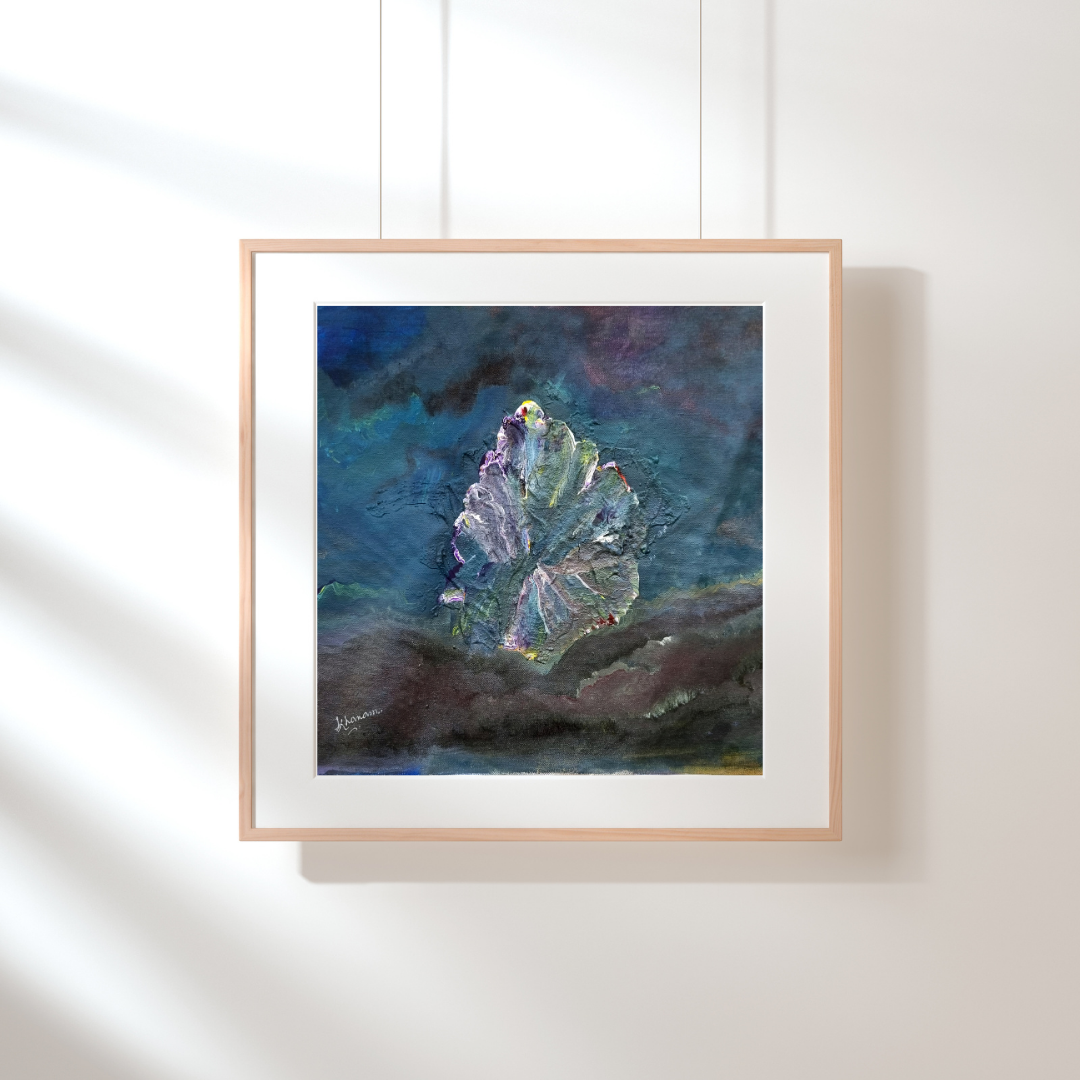 Framed abstract painting on a white wall